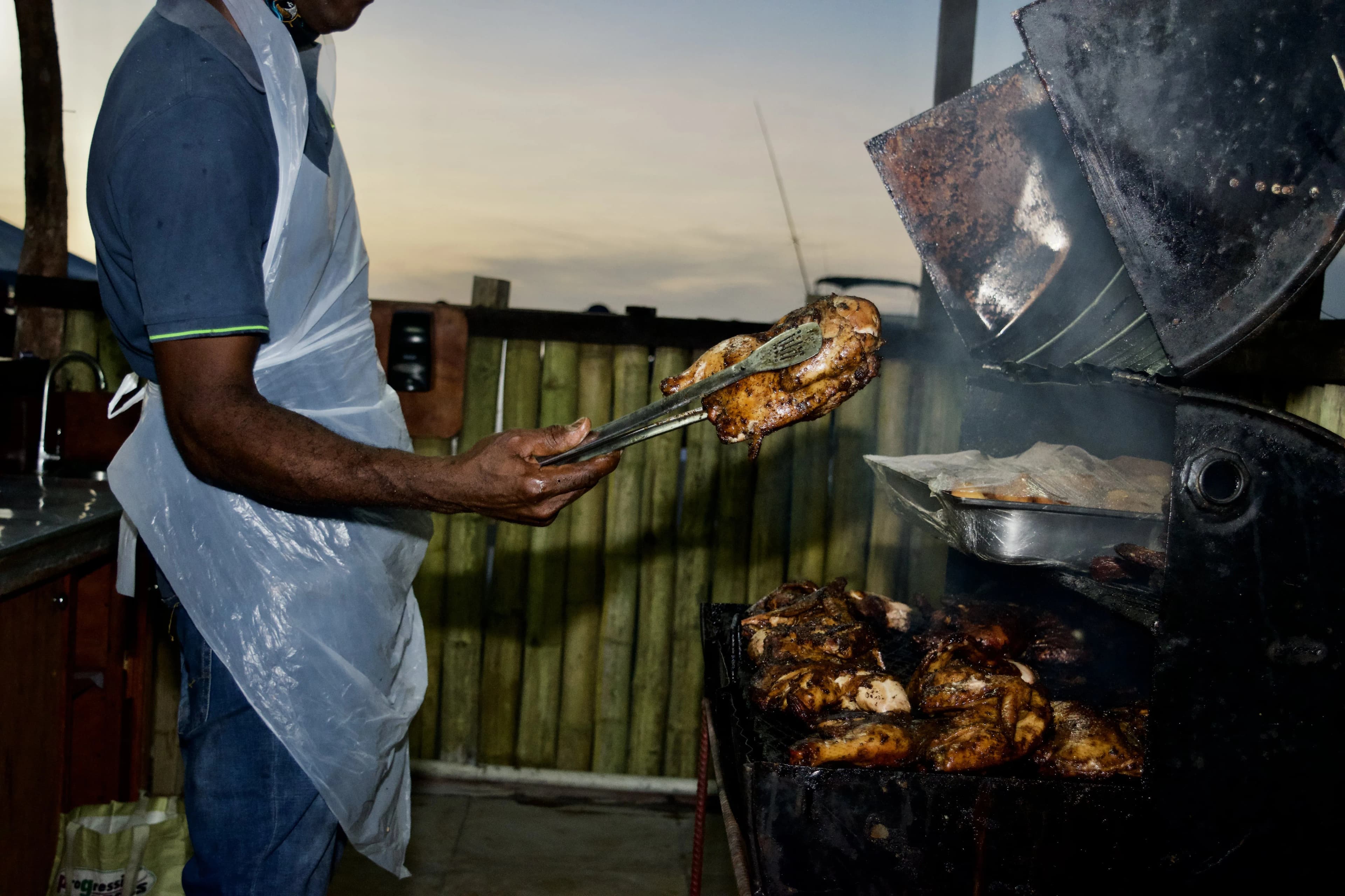 Jerk chicken on the grill at Mystic Flava